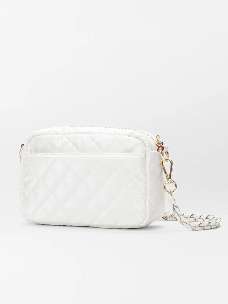 White MZ Wallace Mini Crosby in Pearl Metallic Oxford wristlet with an Italian leather strap and gold-tone hardware, displayed against a light gray background.