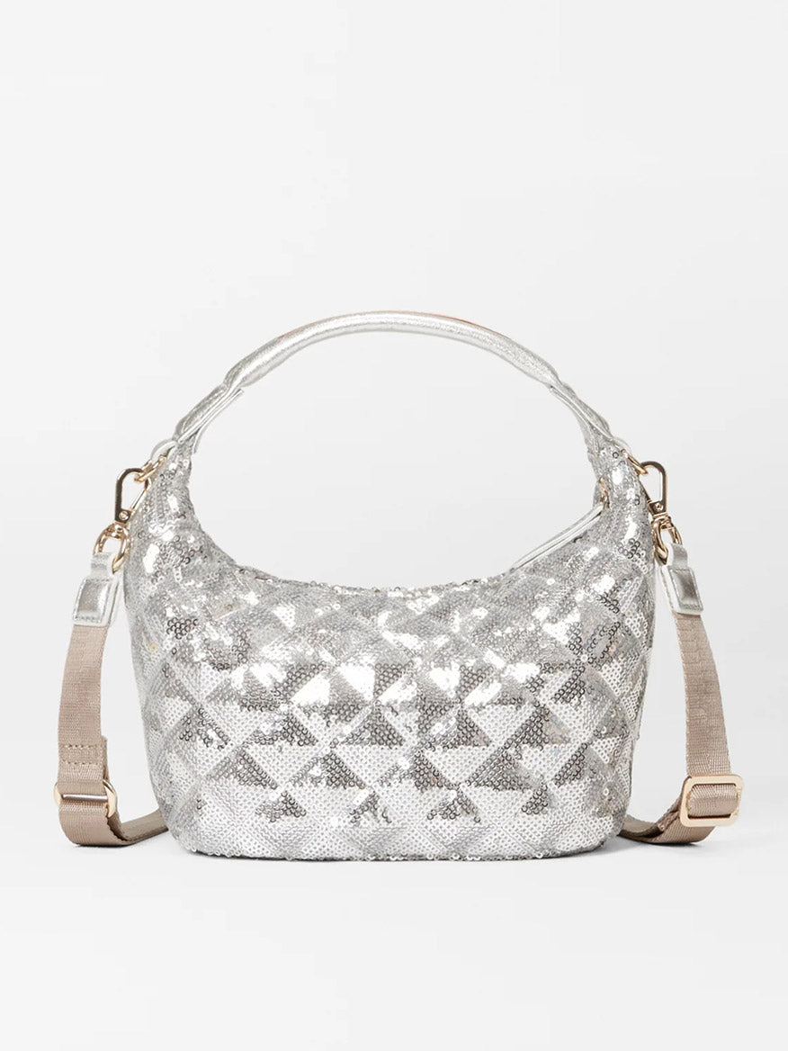 The MZ Wallace Mini Hobo in Ice Multi Sequin Oxford showcases a silver sequined design with geometric patterns, complete with a top handle and a detachable beige strap on a plain background.