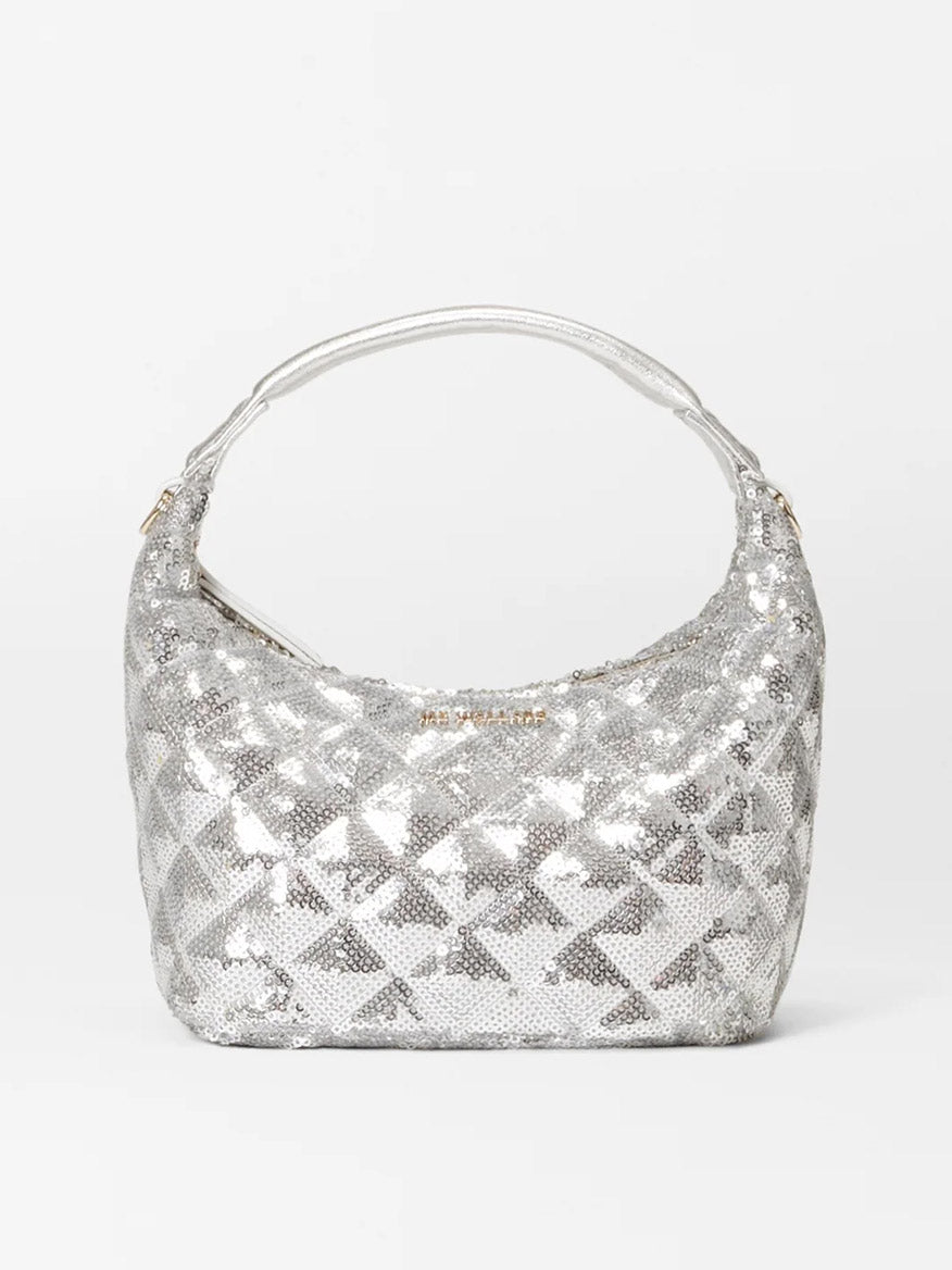 The MZ Wallace Mini Hobo in Ice Multi Sequin Oxford is a striking silver sequined crossbody bag featuring a geometric pattern and a single strap, perfect for enhancing any plain background with its sparkle.