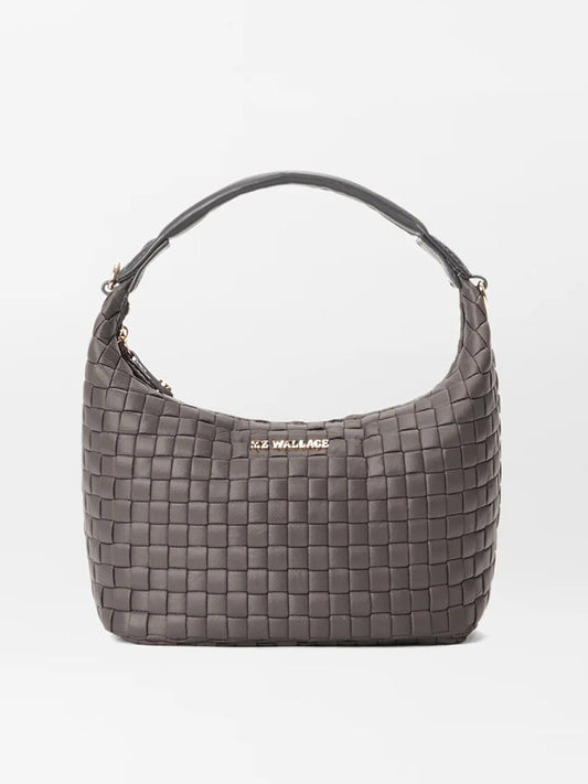 The MZ Wallace Mini Woven Hobo in Magnet Oxford features a grey woven design with gold metal accents and a padded leather handle, proudly showcasing the "MZ WALLACE" brand name on the front.