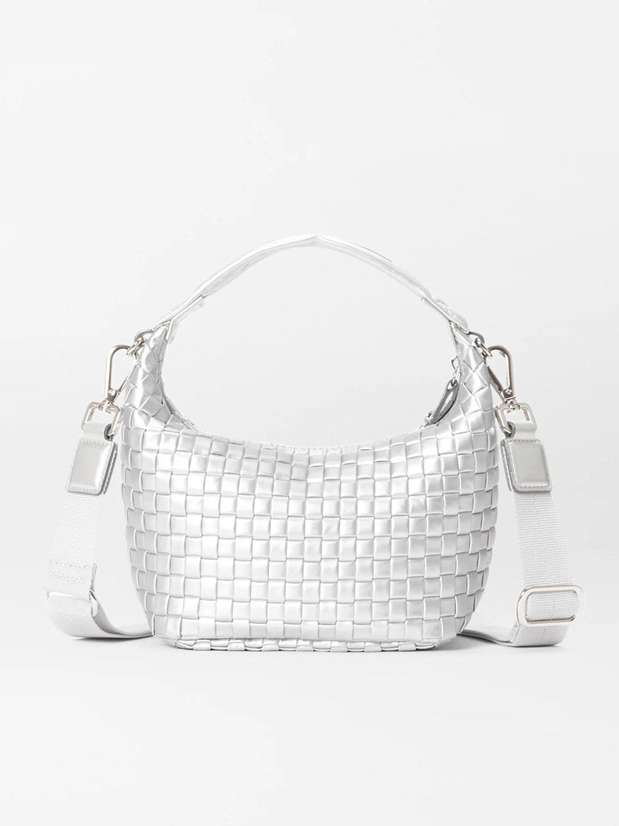 The MZ Wallace Mini Woven Hobo in Matte Silver Oxford, featuring a short handle and an adjustable nylon crossbody strap, is elegantly enhanced with natural Italian leather trim and showcased against a plain white background.