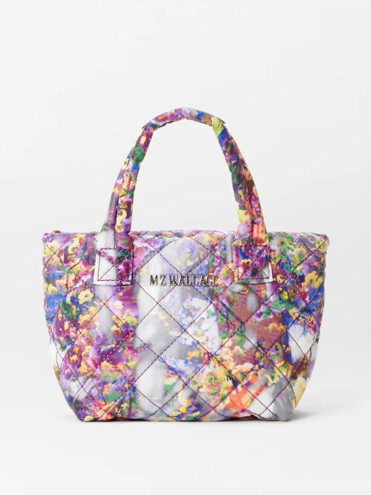 Colorful floral print MZ Wallace Petite Metro Tote Deluxe in Cherry Blossom Oxford, featuring adjustable crossbody strap, displayed against a plain white background.