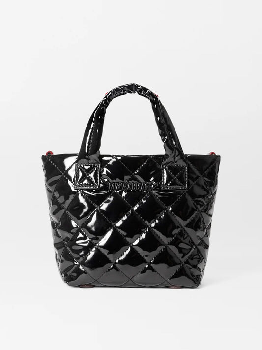 MZ Wallace Petite Metro Tote Deluxe in Black Lacquer Oxford, a black quilted mini nylon bag with a glossy finish, showcases Italian leather trim, two short handles, and visible stitching against a plain white background.