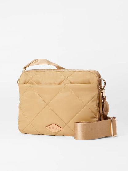 Quilted MZ Wallace Madison crossbody bag in Camel Bedford with a zip top, external pocket, and a thick shoulder strap, displayed against a white background.