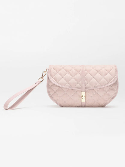 The MZ Wallace Small Astor Convertible Clutch in City Pink Oxford features quilted fabric, a gold clasp, Italian leather trim, and a detachable wrist strap, shown against a plain white background.