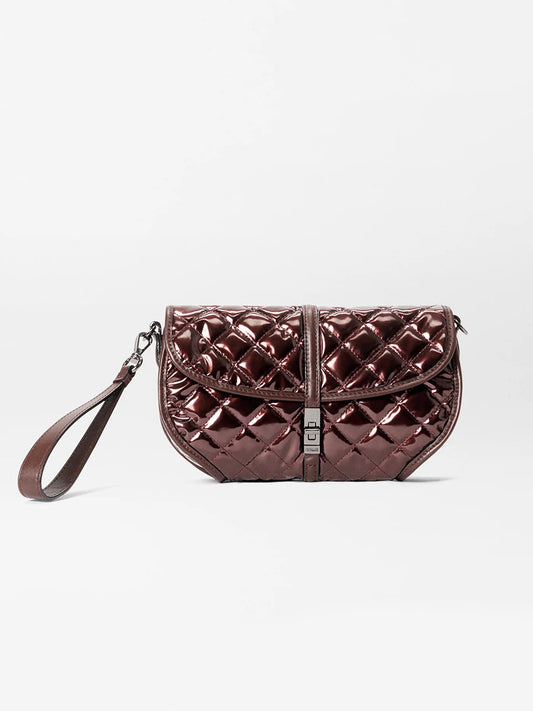 The MZ Wallace Small Astor Convertible Clutch in Bordeaux Lacquer Oxford features a quilted, metallic brown finish, wrist strap, Italian leather trim, and front buckle closure, shown against a plain white background.
