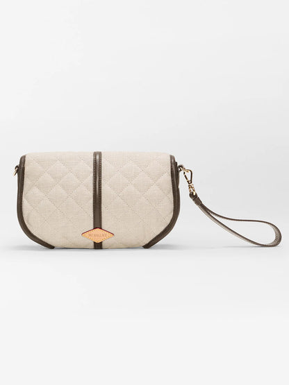 The MZ Wallace Small Astor Convertible Clutch in Sandy Linen Fabric features a beige quilted design, Italian leather trim, and a detachable strap, shown on a plain white background.