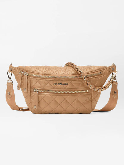 The MZ Wallace Small Crosby Sling Bag in Caramel Oxford features a quilted design with a diamond pattern, Italian leather trim, a front zipper pocket, and a detachable chain strap, shown against a white background.