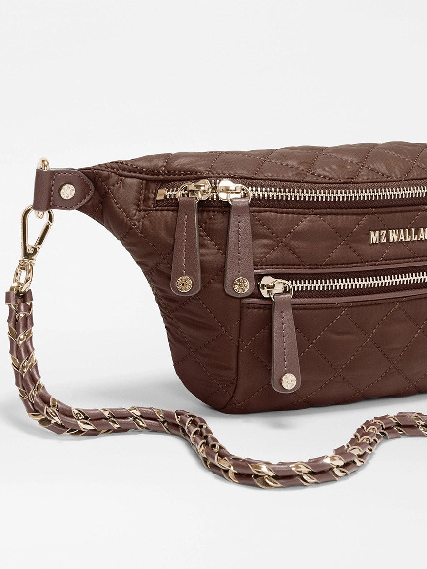 MZ Wallace Small Crosby Sling Bag in Walnut Oxford: a brown quilted recycled nylon sling bag with gold-tone hardware and an adjustable, detachable chain strap.