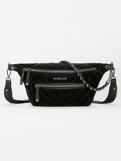 MZ Wallace Small Crosby Sling Bag in black quilted velvet, featuring two zippered front pockets and a chain-link strap.