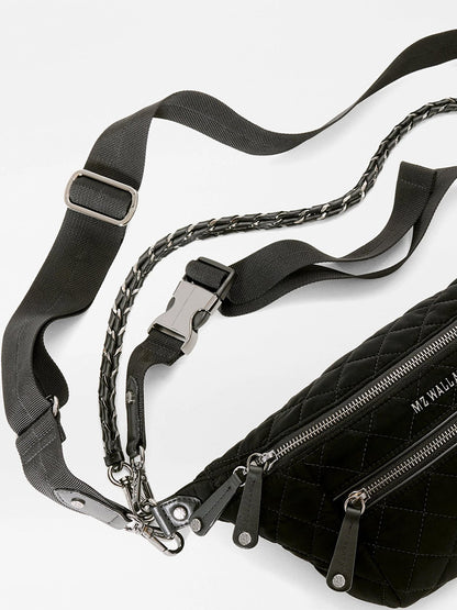 MZ Wallace Small Crosby Sling Bag in black quilted Italian leather with an adjustable webbing strap and a decorative chain handle.