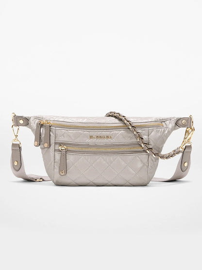 The MZ Wallace Small Crosby Sling Bag in Sable Pearl Metallic Oxford features a quilted design, gold zippers, chain strap detailing, and two zippered front pockets.
