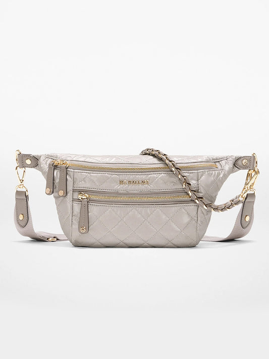 The MZ Wallace Small Crosby Sling Bag in Sable Pearl Metallic Oxford features a quilted design, gold zippers, chain strap detailing, and two zippered front pockets.