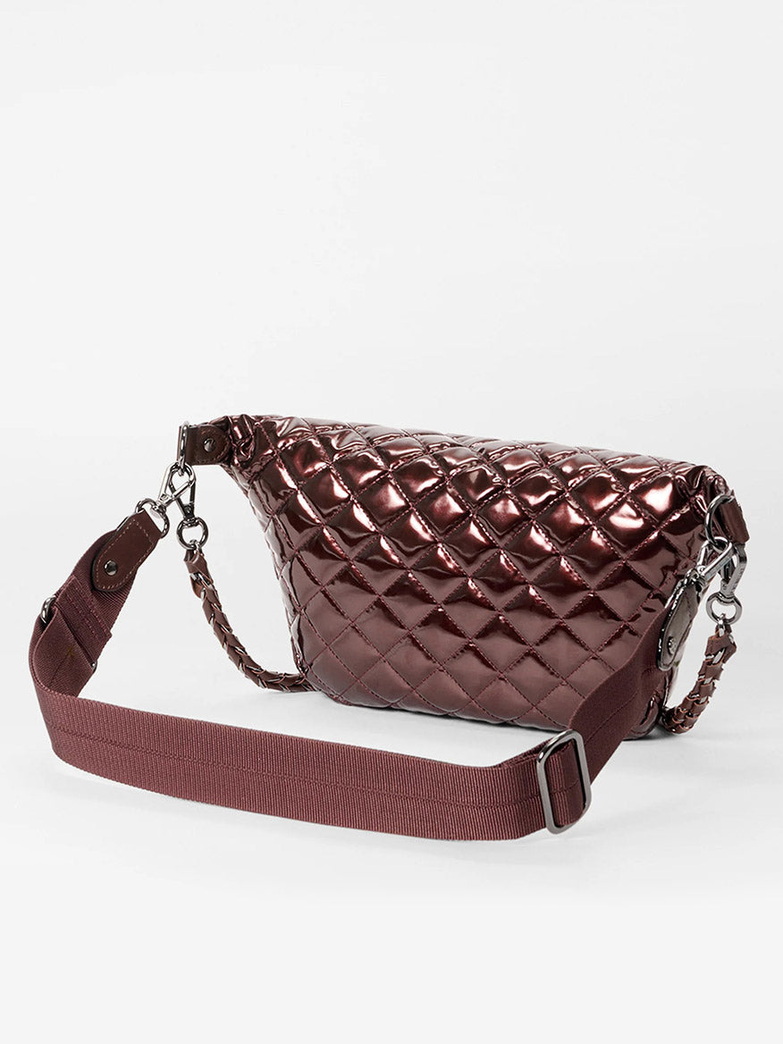 The MZ Wallace Small Crosby Sling Bag in Bordeaux Lacquer Oxford is shown with its wide adjustable strap against a plain white background.