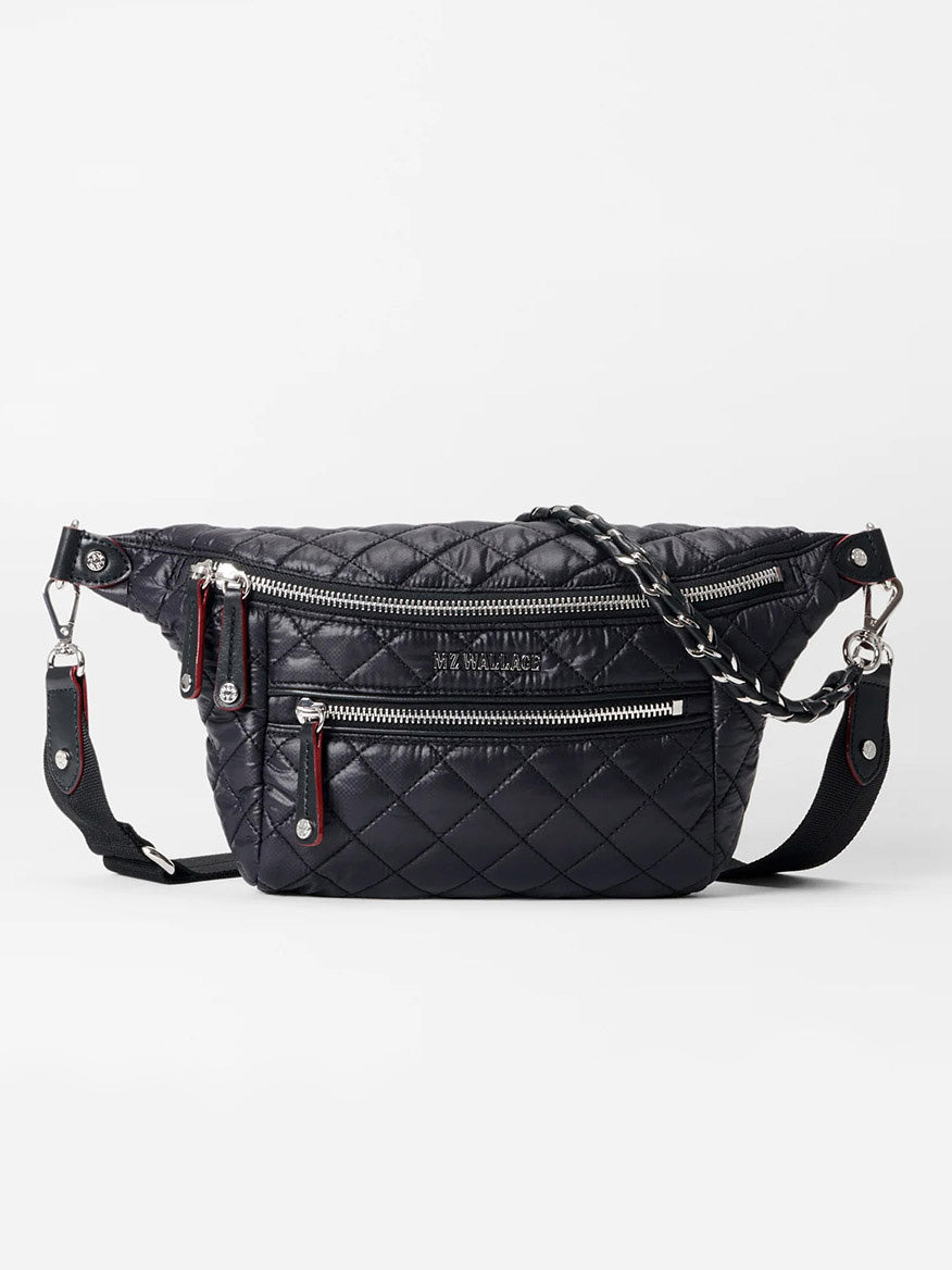 The MZ Wallace Small Crosby Sling Bag in Black Oxford is a quilted crossbody bag with exterior pockets and a stylish braided strap, ideal for organizing your essentials.