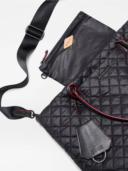 Introducing the MZ Wallace Small Daily Tote in Black Oxford—a quilted black tote featuring red trim, black handles, an adjustable shoulder strap, and a matching zippered pouch. Both pieces are adorned with KUZIMAR branding and crafted from premium materials for everyday elegance.