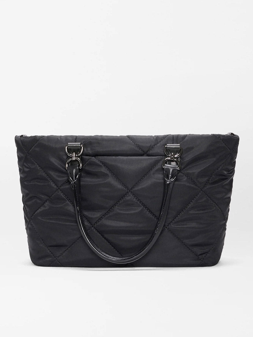 The MZ Wallace Small Madison E/W Tote in Black Bedford features a black quilted design, double handles, Italian leather trim, and metal hardware in a slim east-west silhouette against a plain white background.