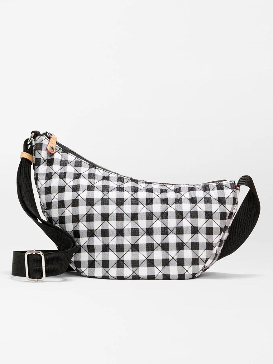 The MZ Wallace Small Metro Smile Bag in Black/White Gingham Oxford features a quilted gingham pattern, black adjustable nylon strap, Italian leather trim, and zipper closure.
