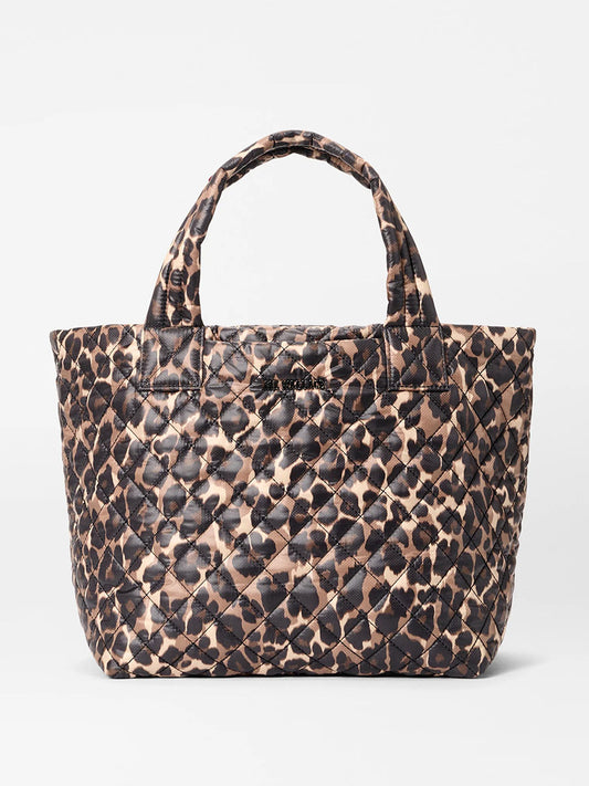 The MZ Wallace Small Metro Tote Deluxe in Leopard Oxford features a brown and black animal print, two handles, a slightly glossy finish, and elegant Italian leather trim.