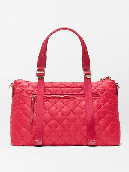 The MZ Wallace Small Park Satchel in Apple Oxford features red quilted fabric, two top handles, a front zip pocket, and gold-tone hardware, displayed against a plain white background.