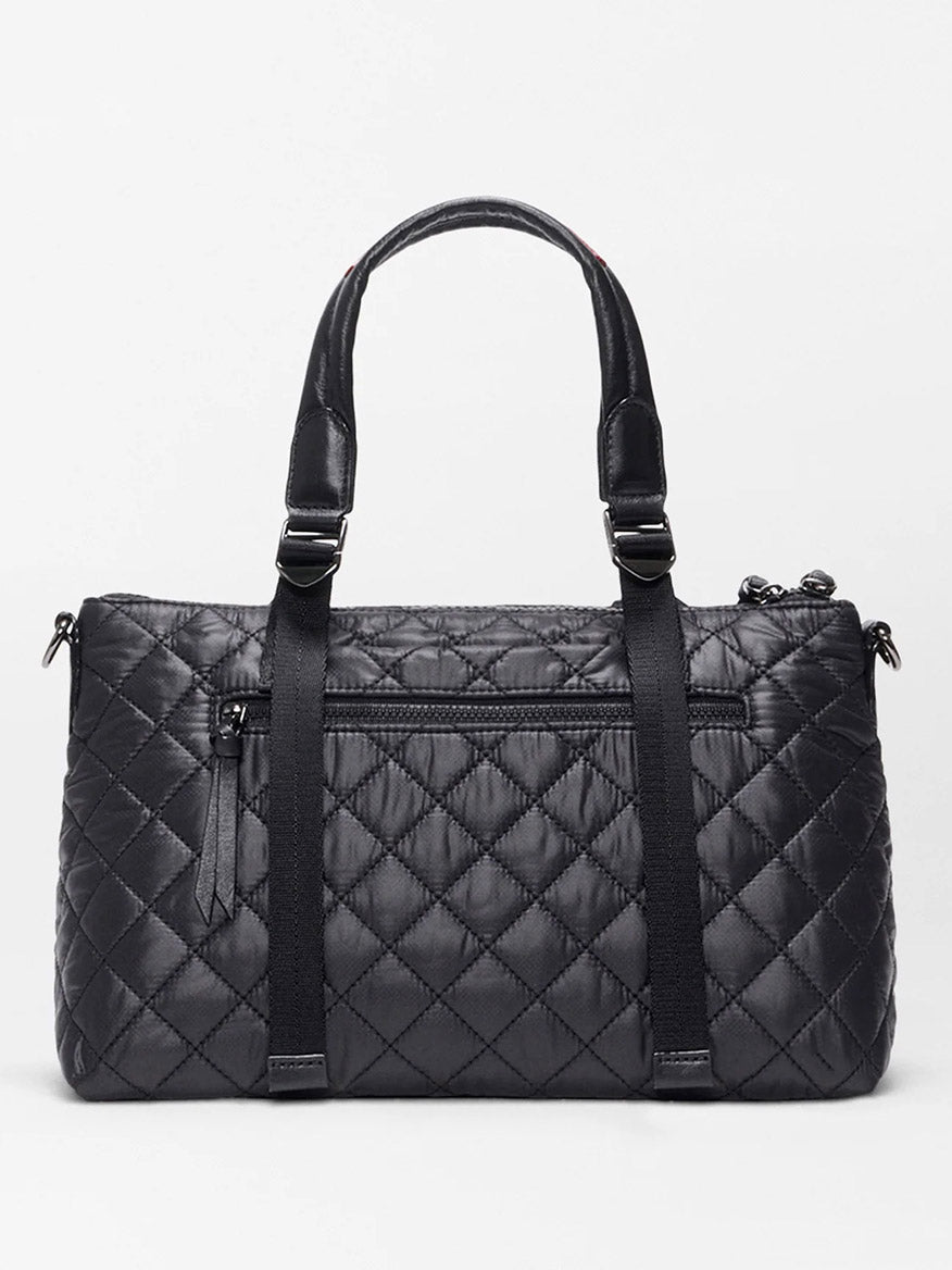 The MZ Wallace Small Park Satchel in Black Oxford features a quilted design, double handles, front zip pocket, and vertical strap details, shown against a plain light background.