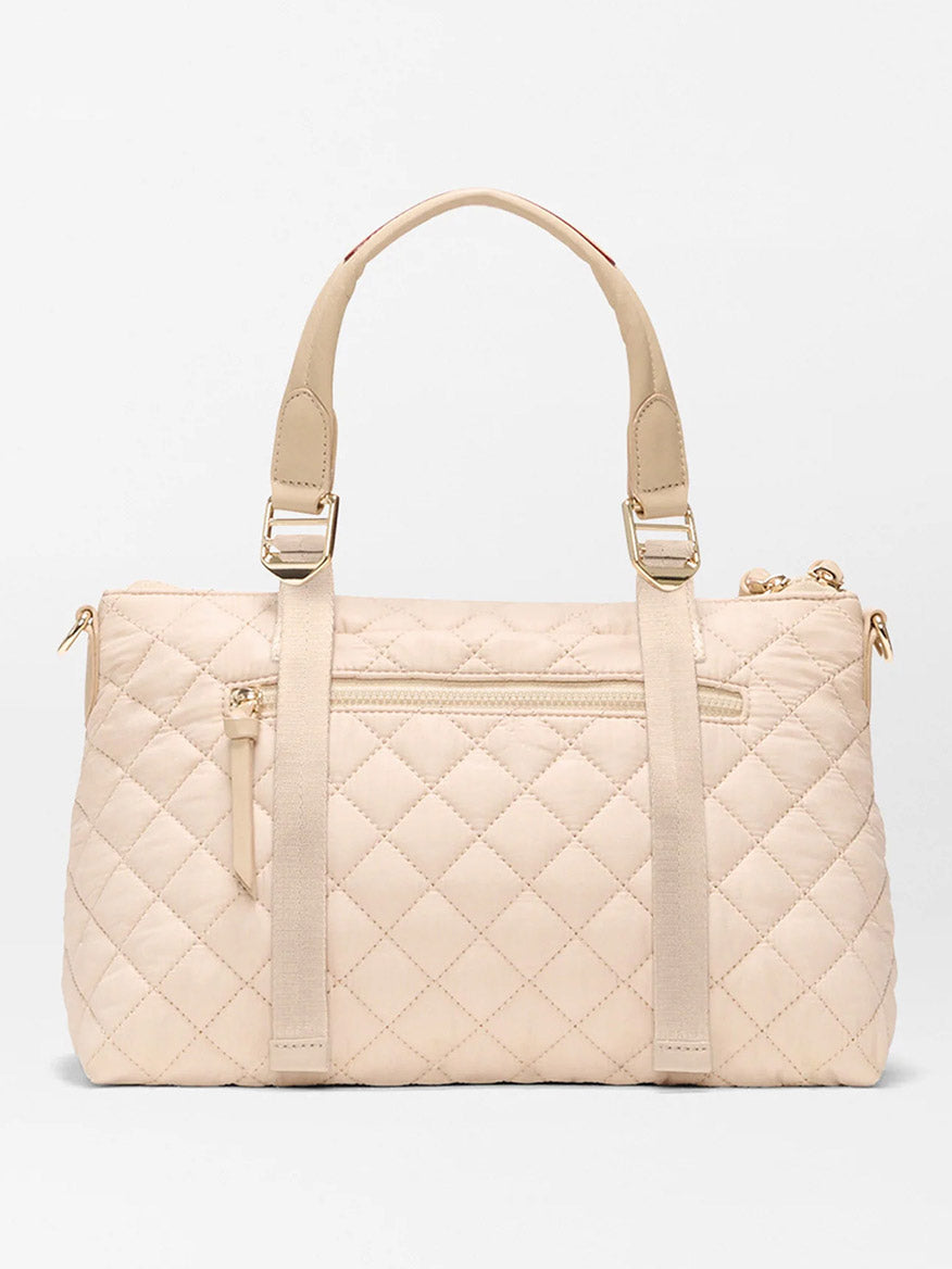 MZ Wallace Small Park Satchel in Buff Oxford: a quilted bag with gold hardware, dual top handles, front zip pocket, and vertical strap accents—ideal for daily use.