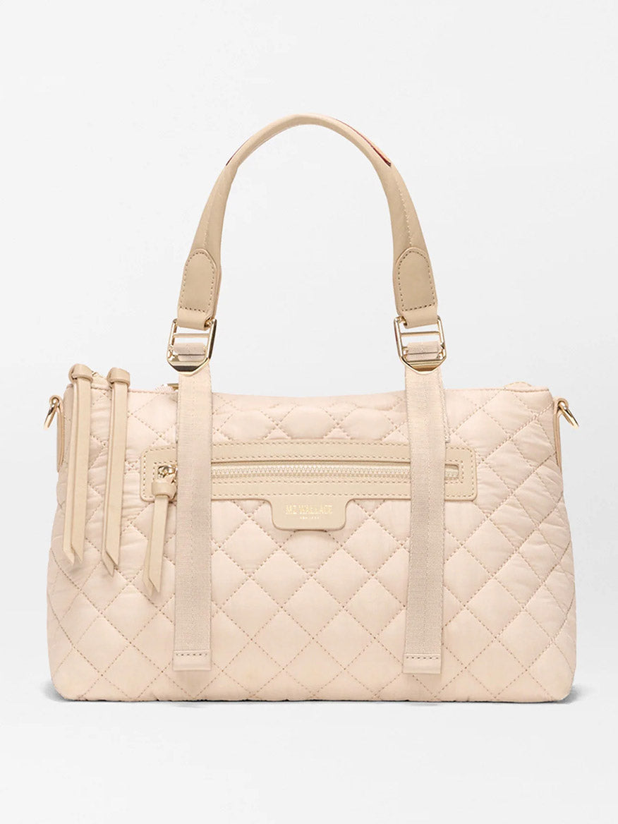 The MZ Wallace Small Park Satchel in Buff Oxford offers effortless style with beige quilted design, two handles, gold hardware, a front zipper pocket, and a subtle logo—making it the perfect everyday satchel.