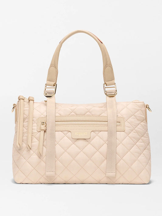 The MZ Wallace Small Park Satchel in Buff Oxford offers effortless style with beige quilted design, two handles, gold hardware, a front zipper pocket, and a subtle logo—making it the perfect everyday satchel.