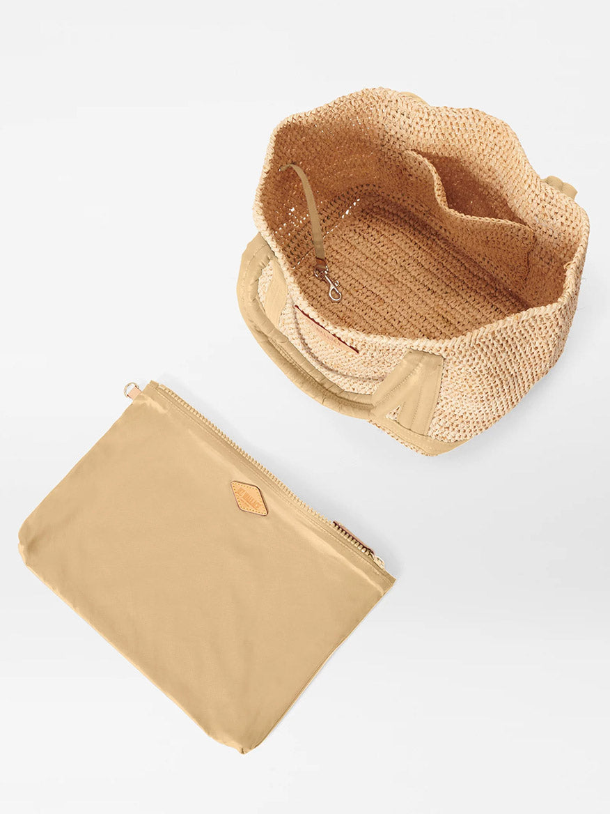 A MZ Wallace Small Raffia Tote in Raffia/Camel with padded nylon handles and a zippered pouch.