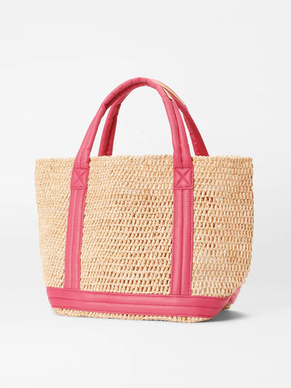 A MZ Wallace Small Raffia Tote in Raffia/Zinnia with pink padded nylon handles and trim, displayed on a white background.
