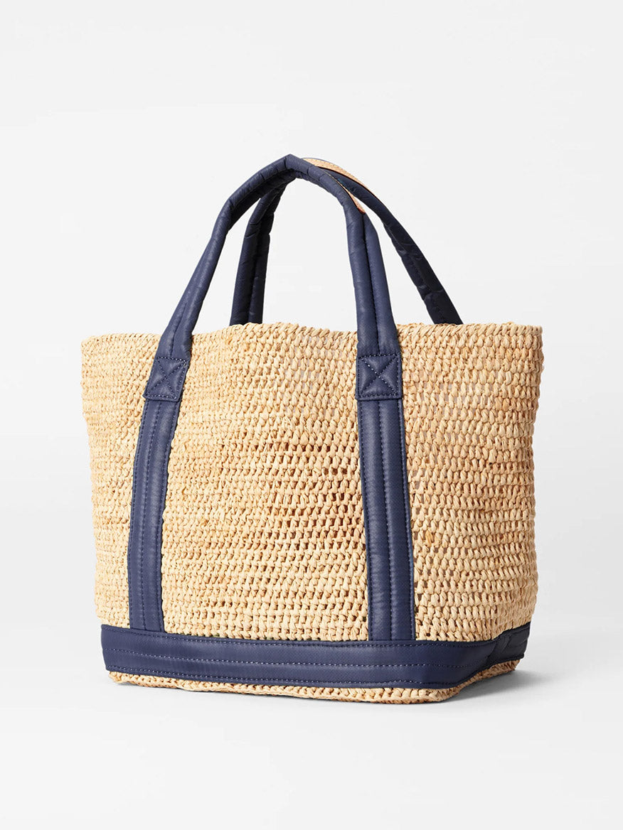 Woven MZ Wallace Small Raffia Tote in Raffia/Navy with dark blue padded nylon handles and trim.