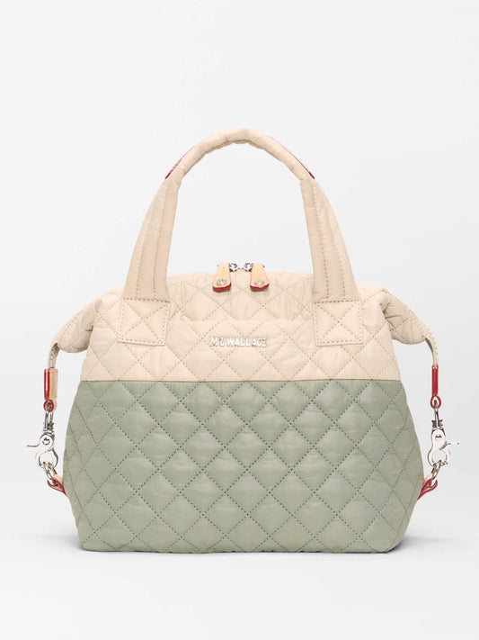 The MZ Wallace Small Sutton Deluxe in Agave Green/Buff Oxford features quilted beige and light green panels, dual handles, a silver zipper, and the "MZ WALLACE" logo on the front.