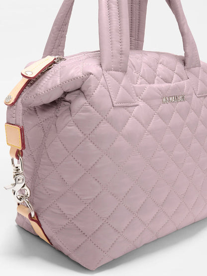 A close-up of the MZ Wallace Small Sutton Deluxe in Quail Oxford—a small handbag with short handles and detachable strap, designed for style and versatility as a convertible tote crossbody.