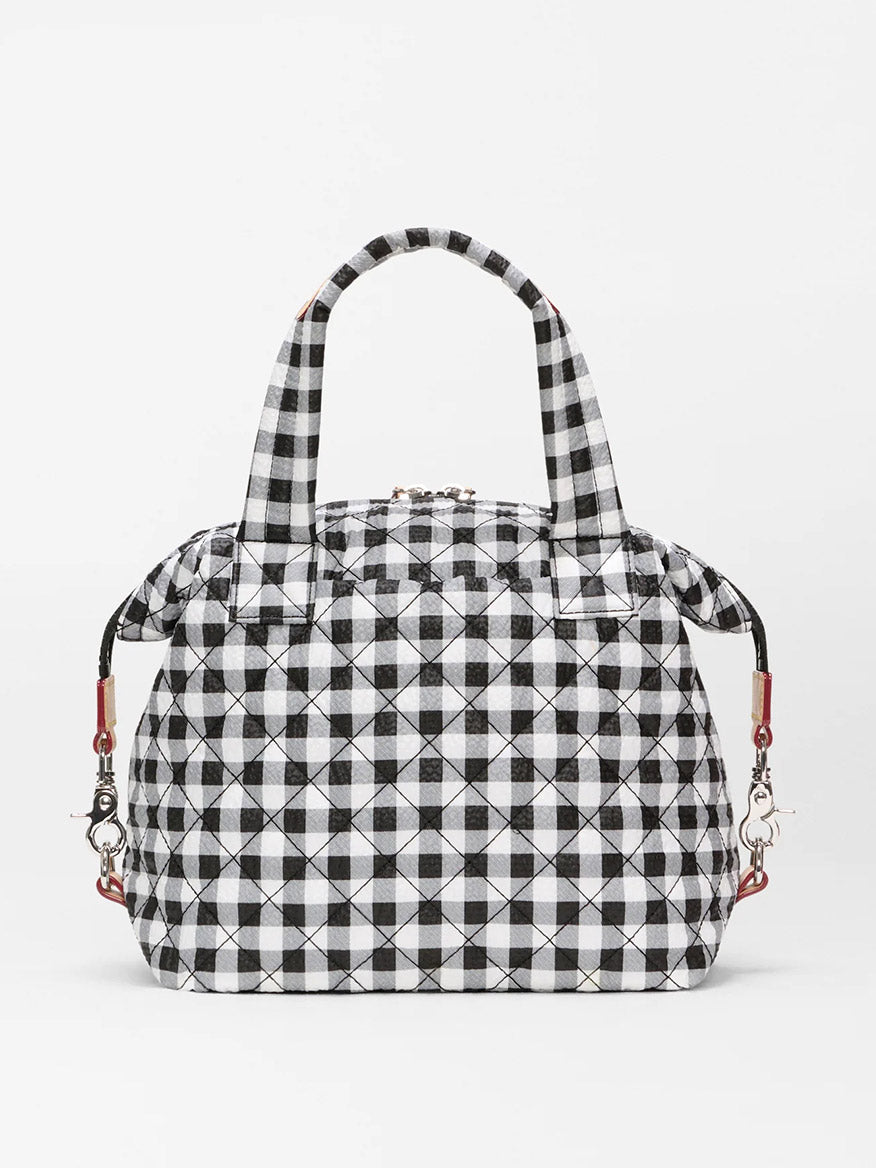 The MZ Wallace Small Sutton Deluxe in Black/White Gingham Oxford features two handles, metal clasps, and Italian leather trim, shown against a plain white background.