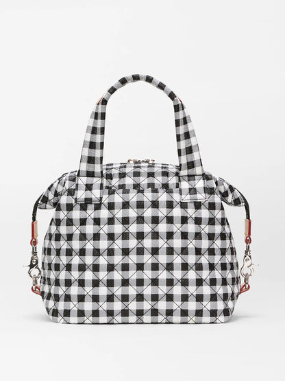 The MZ Wallace Small Sutton Deluxe in Black/White Gingham Oxford features two handles, metal clasps, and Italian leather trim, shown against a plain white background.
