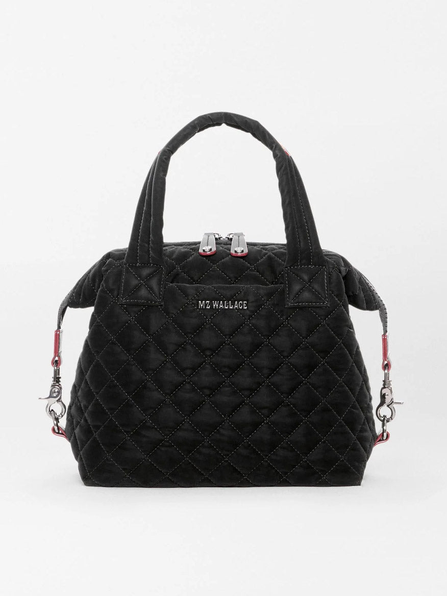 MZ Wallace Small Sutton Deluxe in Black Velvet Finish handbag with two top handles, zippered closure, and red strap attachments.