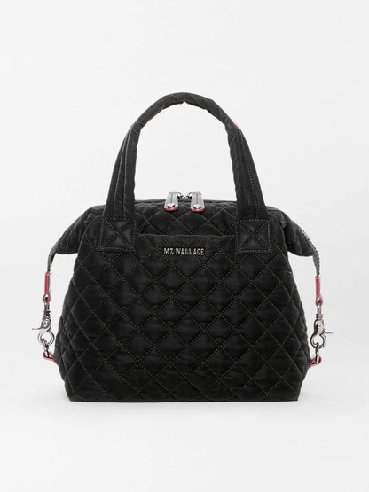 MZ Wallace Small Sutton Deluxe in Black Velvet Finish handbag with two top handles, zippered closure, and red strap attachments.