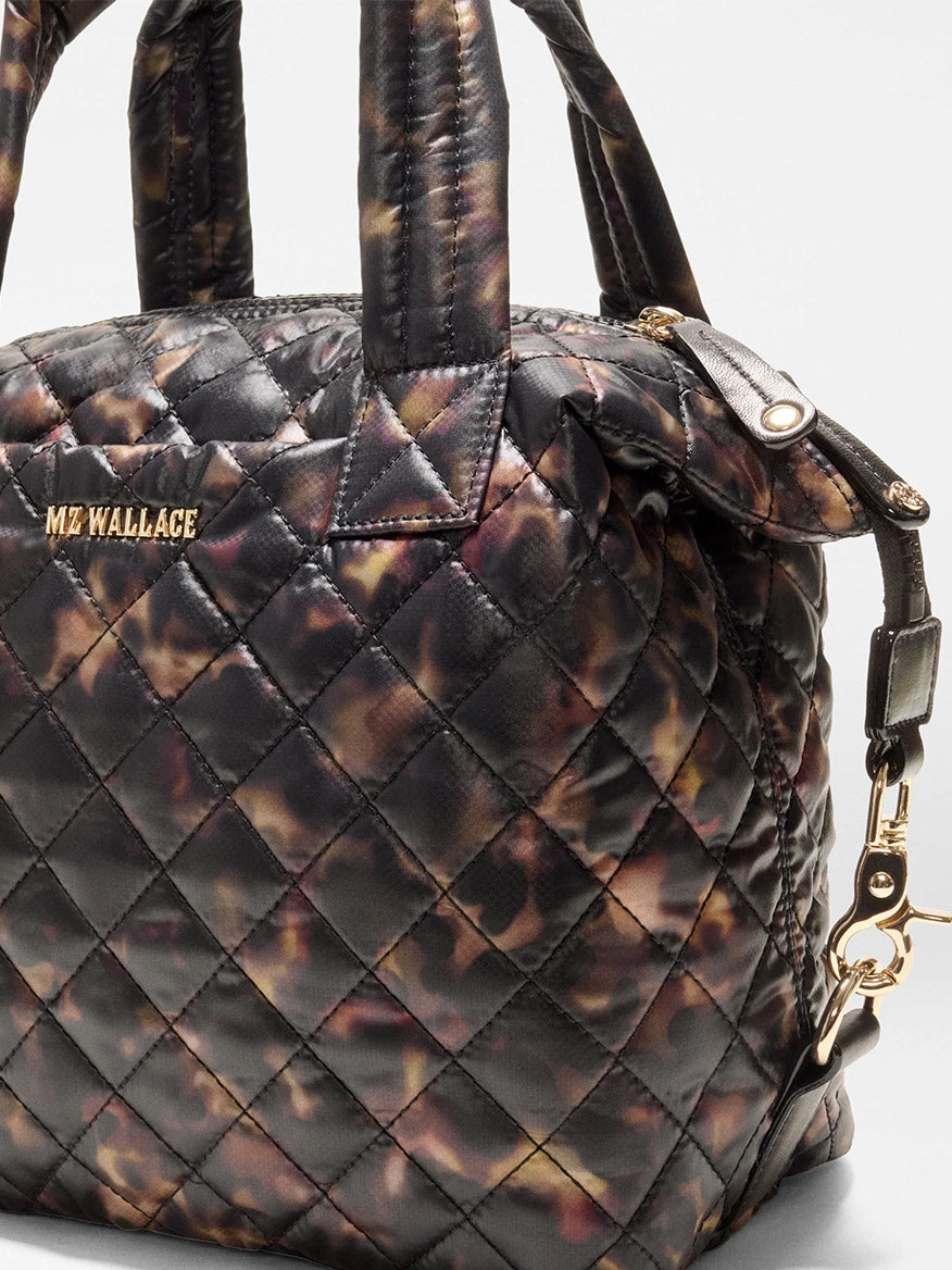 MZ Wallace Small Sutton Deluxe in Tortoise Shell Oxford, a small quilted handbag in dark brown and black with gold-toned hardware and a versatile crossbody tote design.