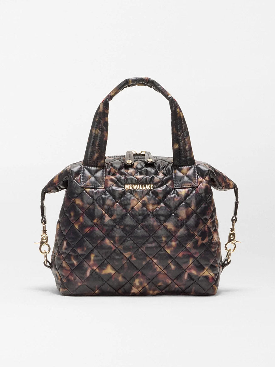 MZ Wallace Small Sutton Deluxe in Tortoise Shell Oxford, a quilted handbag with gold-tone hardware and top handles, designed as a versatile crossbody tote.