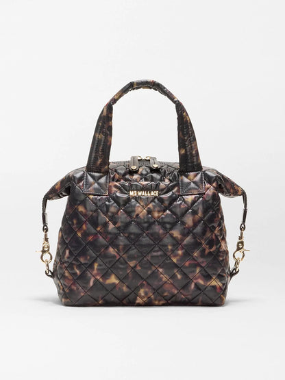 MZ Wallace Small Sutton Deluxe in Tortoise Shell Oxford, a quilted handbag with gold-tone hardware and top handles, designed as a versatile crossbody tote.