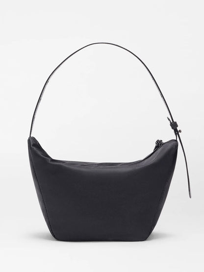 The MZ Wallace Small Waverly Hobo in Black Bedford, a minimalist shoulder bag with a single strap, zipper closure, REC Bedford fabrication, and Italian leather trim, is shown against a plain white background.