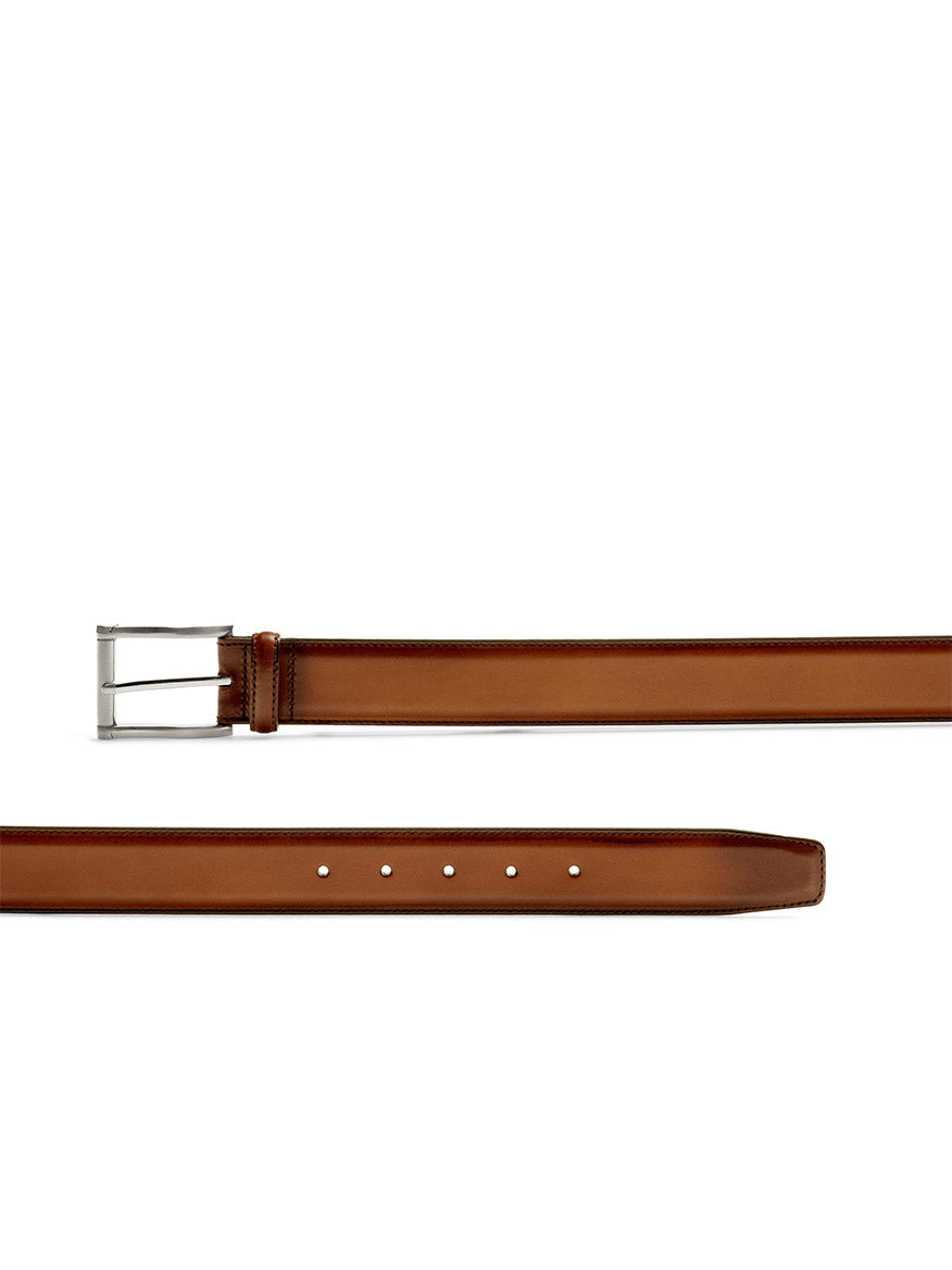 A Magnanni Carbon Belt in Cognac on a white background, crafted by Magnanni.
