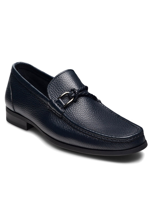 The Magnanni Gentry Soft Braid in Tumbled Navy is a dark blue luxury leather loafer featuring a textured finish, braided strap, low black heel, and classic moccasin construction, displayed on a white background.