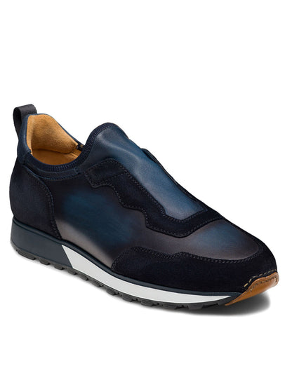 The Magnanni Arco Slip in Navy is a retro-inspired sport sneaker featuring a dark blue and black design, complemented by a white midsole and textured rubber outsole. It is enhanced with our stretch-napa gore system for ultimate comfort.