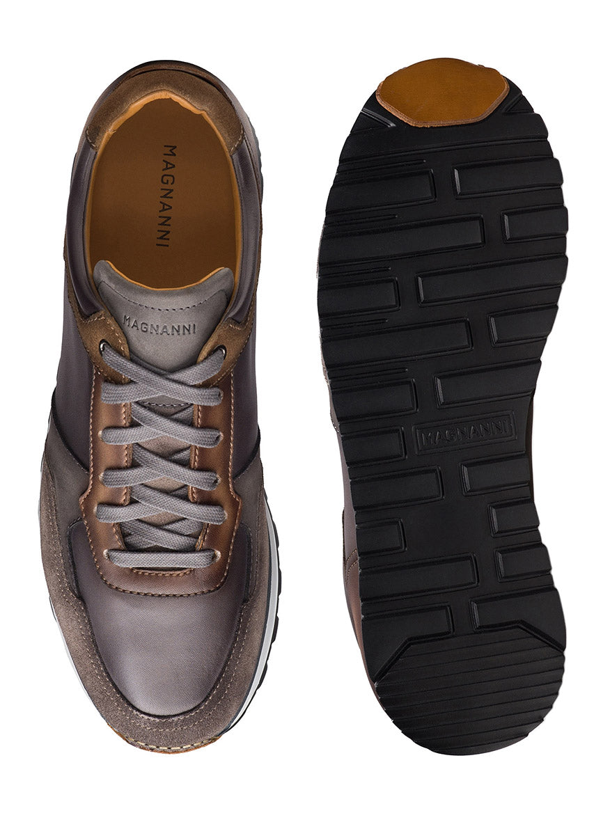 Top and bottom view of the Magnanni Arco in Grey & Brown—a retro sport sneaker with a hand-stitched leather upper, suede accents, tan lining, and a black rubber sole with deep grooves. Expertly crafted in Spain.