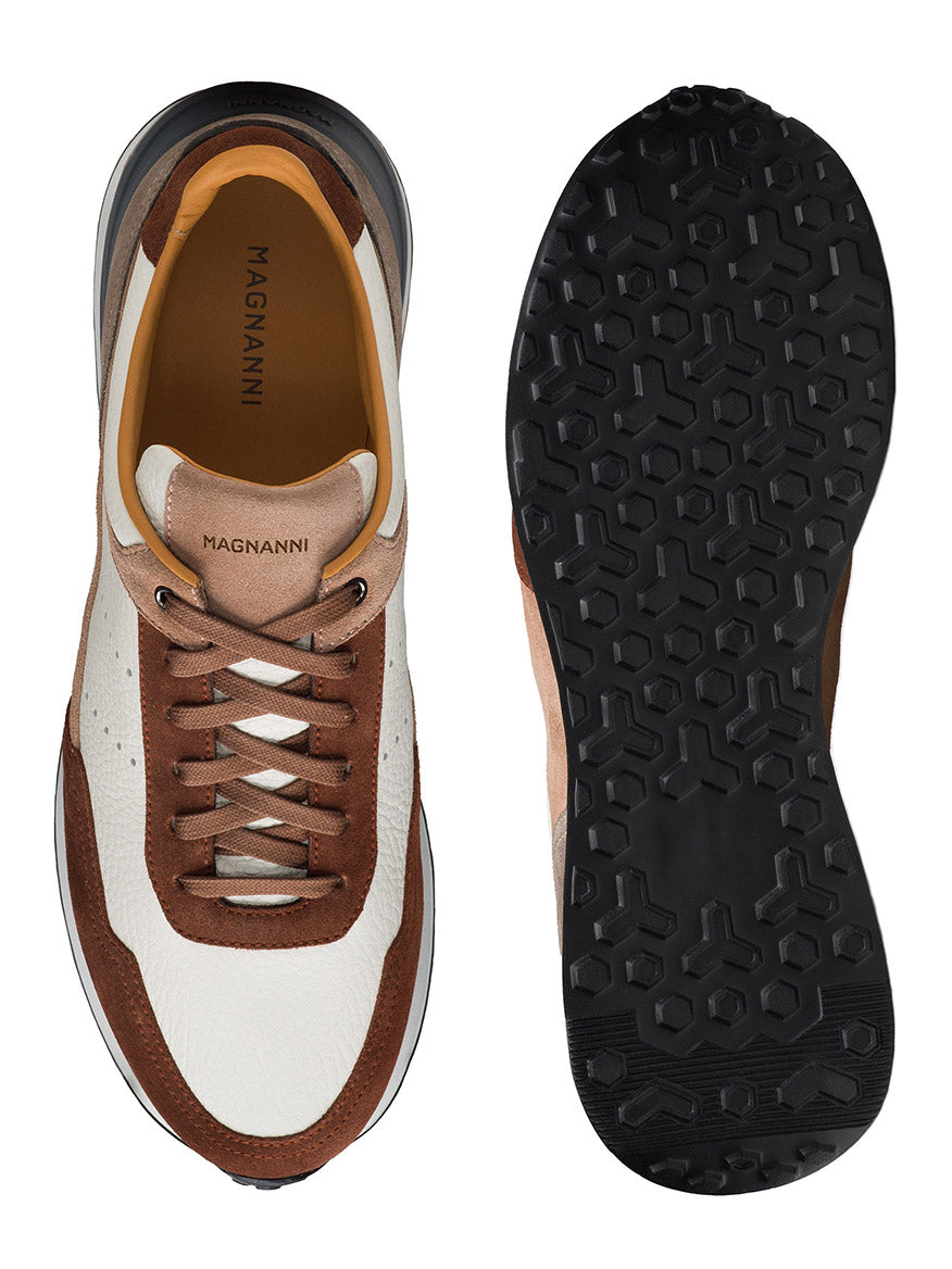 Top and bottom view of the Magnanni Bravo men's sneakers in Castagna Brik/White, showcasing a stylish mix of white, brown, and beige with black outsoles. The cushioned footbed ensures comfort while the brand name "Magnanni" is visible on the insole.