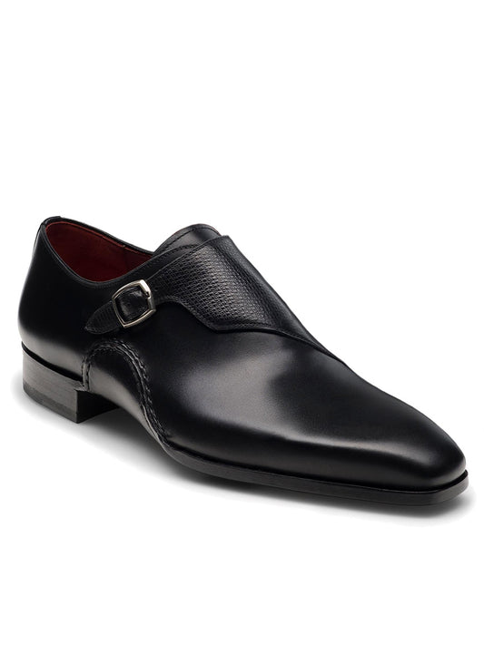 The Magnanni Carver in Black is a sleek black leather dress shoe with a low heel, featuring a monk strap and buckle.