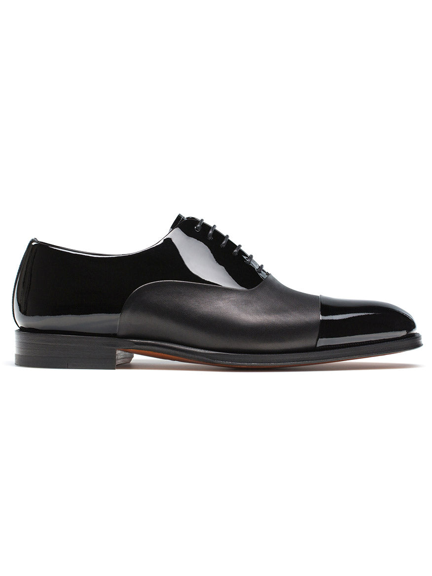 A pair of Magnanni Cesar in Black cap-toe oxford shoes on a white background.