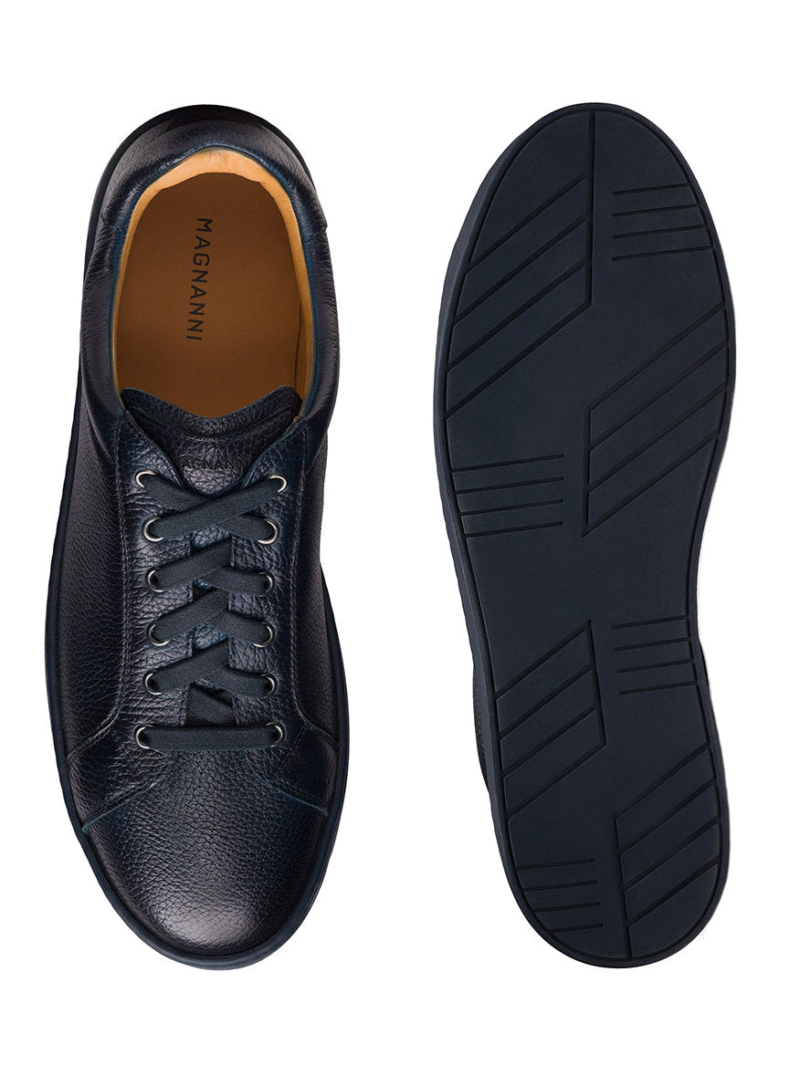 The Magnanni Cote Lo Stretch-Lace in Tumbled Navy men’s sneakers are shown from above and below, featuring a classic stretch lace-up top view and a textured rubber sole.