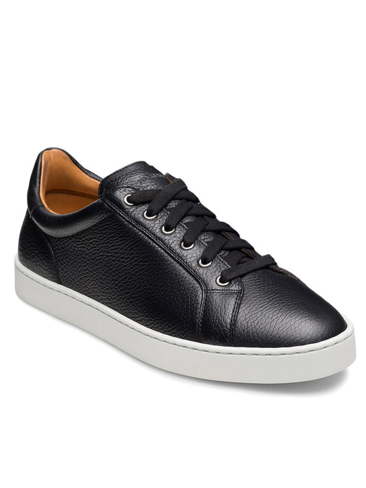 The Magnanni Cote Lo Stretch-Lace in Tumbled Black is a men’s black leather low-top sneaker with a stretch-lace system and white rubber sole, shown at a slight angle on a white background.